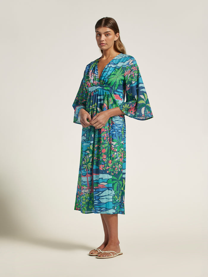 Multicolor tropical-print cotton caftan dress with loose sleeves and deep v-neck, front view.