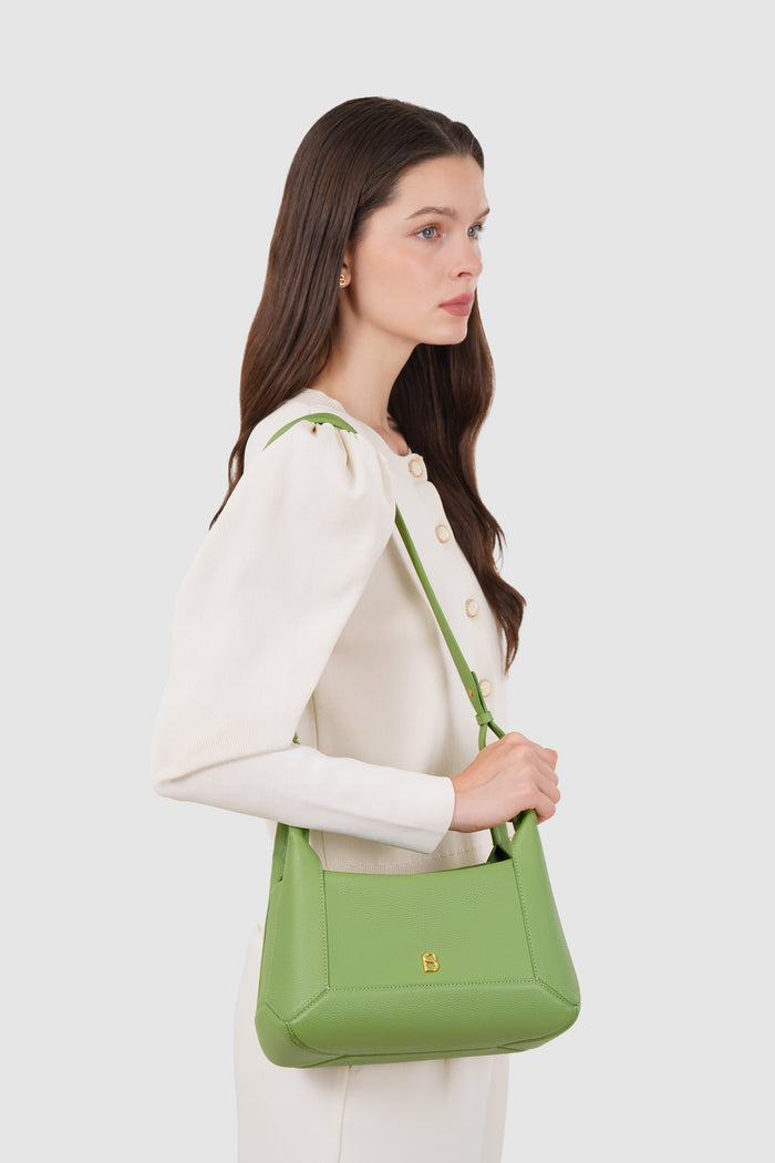 origa flex shoulder bag in moss by buttonscarves carried on shoulder