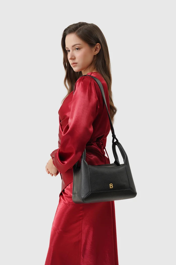 origa flex shoulder bag medium in black by buttonscarves carried on shoulder
