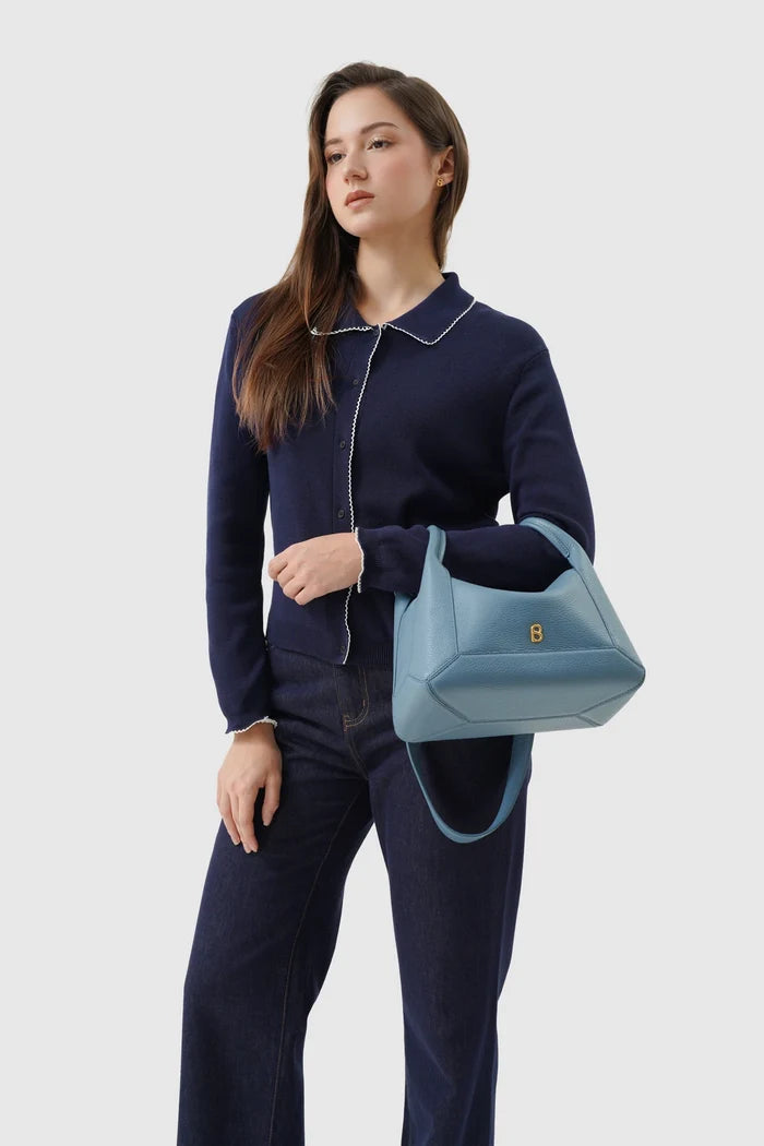 origa flex shoulder bag medium in blue fairy by buttonscarves carried on wrist