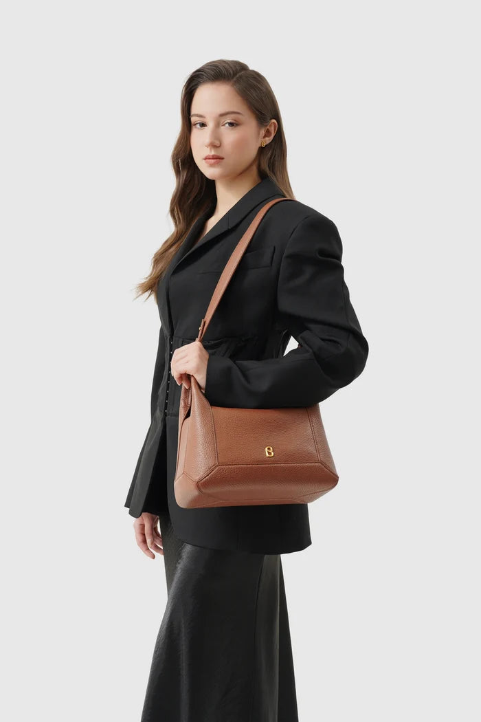 origa flex shoulder bag medium in caramel by buttonscarves carried on shoulder