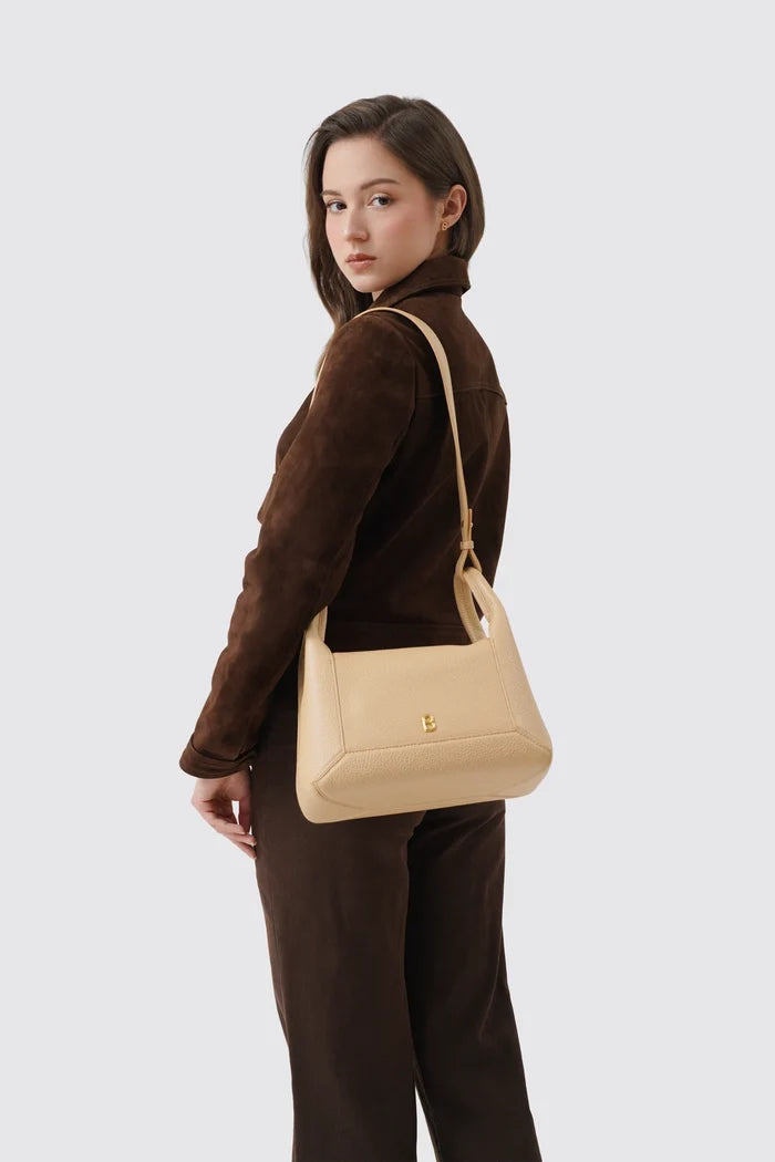 origa flex shoulder bag medium in champagne by buttonscarves carried on shoulder