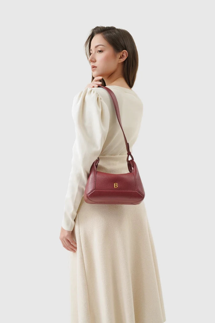 origa flex shoulder bag small in cranberry by buttonscarves carried on shoulder