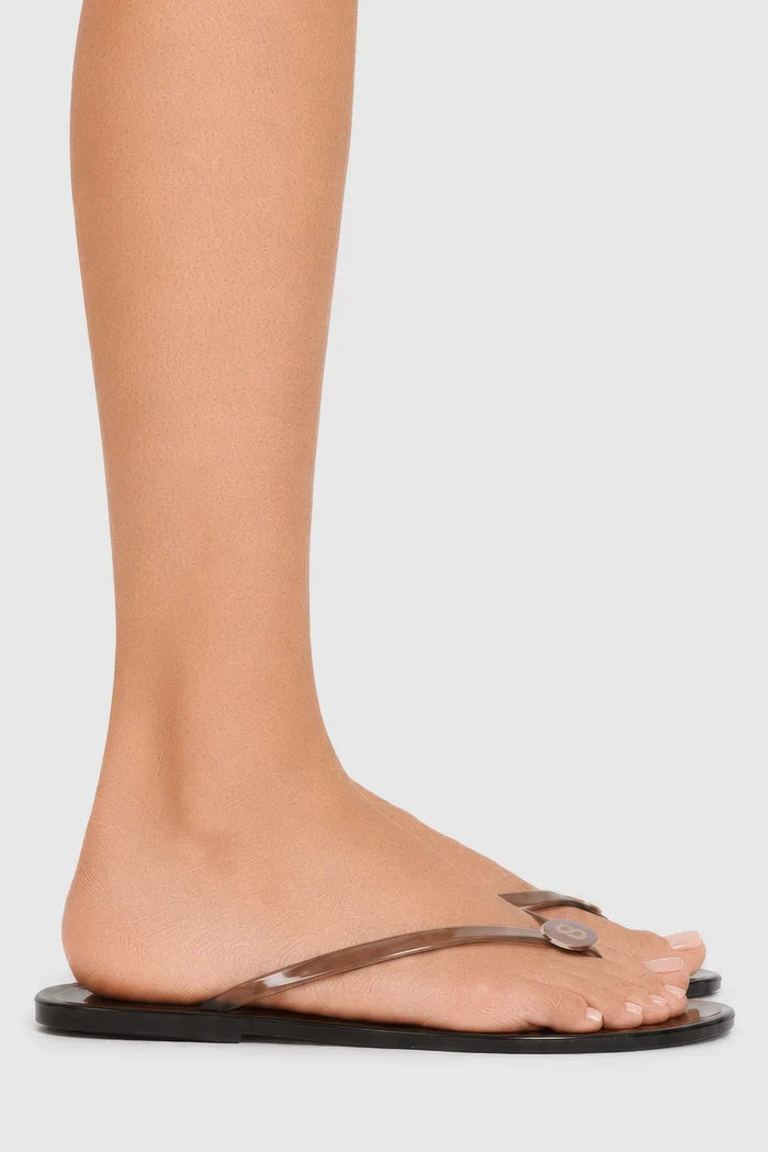orin sandal in brown by buttonscarves worn on feet side view