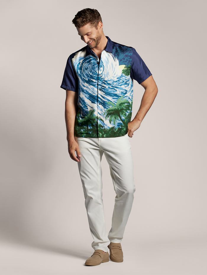 Sand-washed beige silk shirt, plain, overhead view of man looking down and smiling (Images 1 & 2).