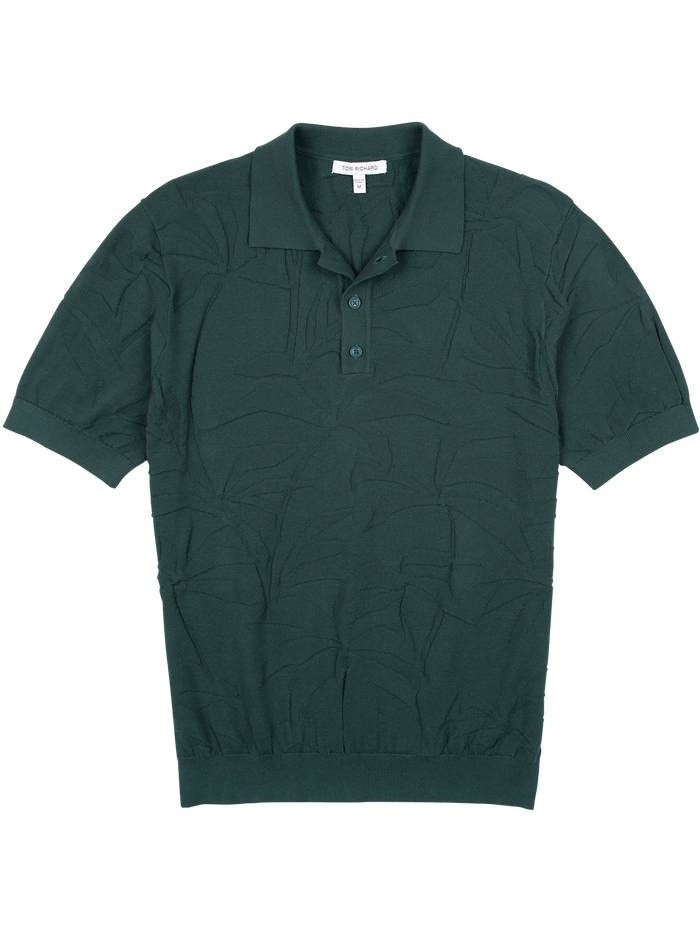Dark green leaf-jacquard cotton polo sweater, short sleeves, three-button collar, front view.