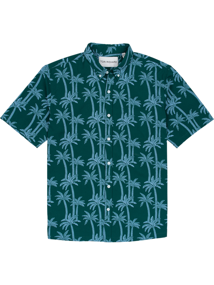 Green short-sleeve shirt with blue palm print and UPF sun protection, front view.