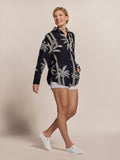 Black palm-lined Leslie top with white shorts, full outfit front view.