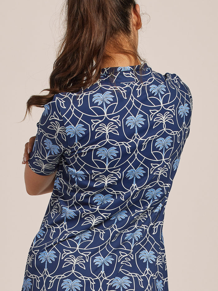 Blue and white leaf-patterned dress, back view.