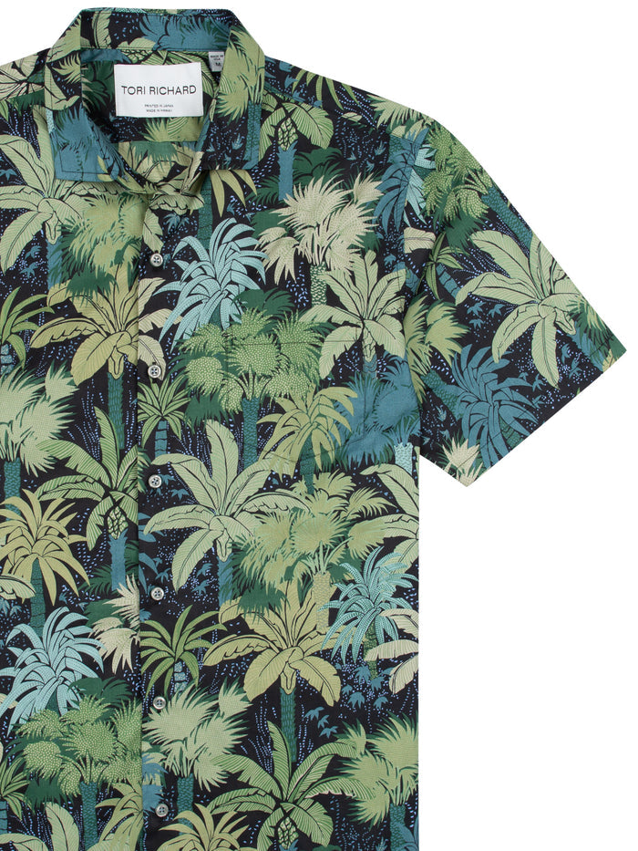 Green and navy blue short-sleeve cotton shirt with green-blue palm print, front view.