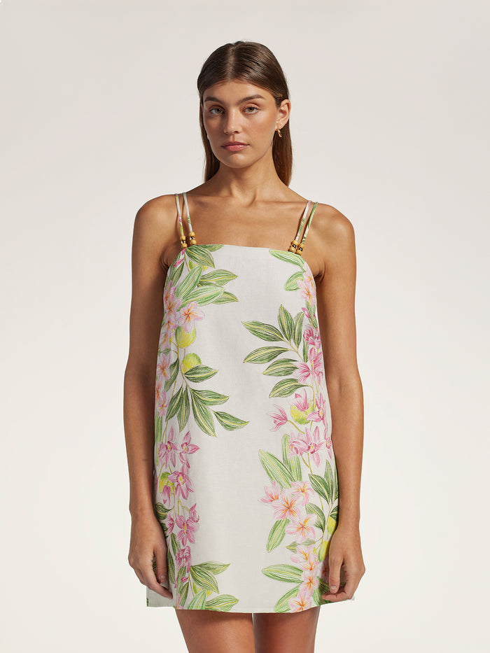 Pink and green floral sleeveless fit-and-flare dress, front view shown on woman/model.