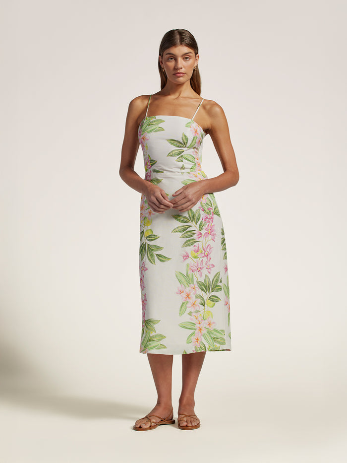 White linen midi dress with adjustable straps, shown full length on model against a plain background.