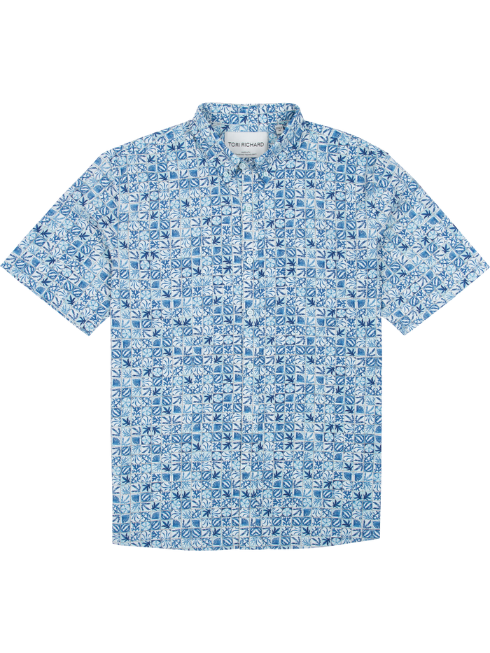 Blue and white geometric floral short-sleeve shirt, moisture-wicking fabric, front view.