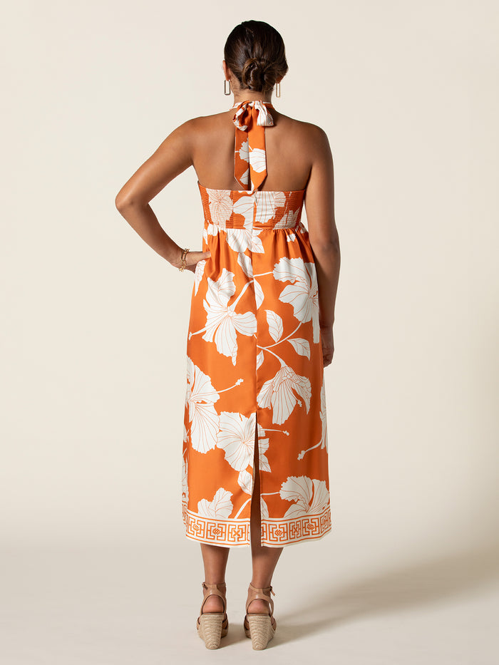 Orange back view, paired with wedge sandals and hoop earrings.