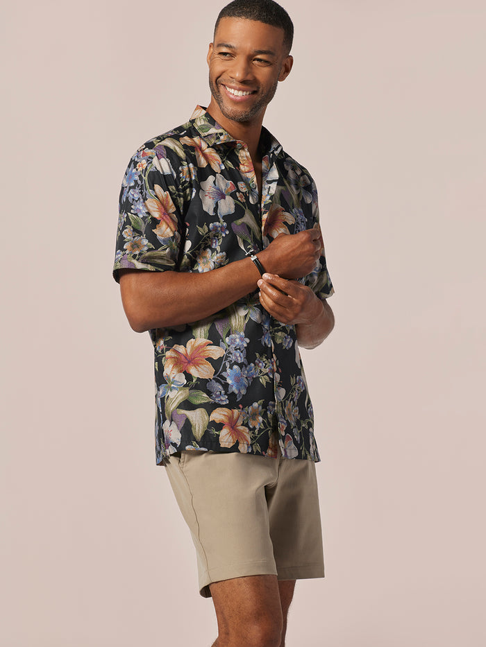 Multicolor Seurat-inspired print short-sleeve Hawaiian shirt with beige shorts, front view.
