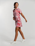 Red and white colorblock polo top and pleated skirt set, front view.