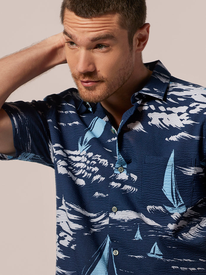 Navy sailboat-print short-sleeve shirt, front view.