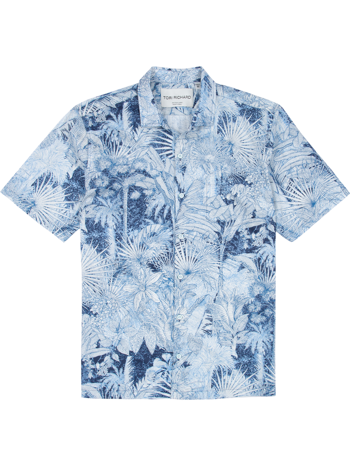 Blue and white tropical leaf-print cotton Hawaiian shirt with visible collar, front view.