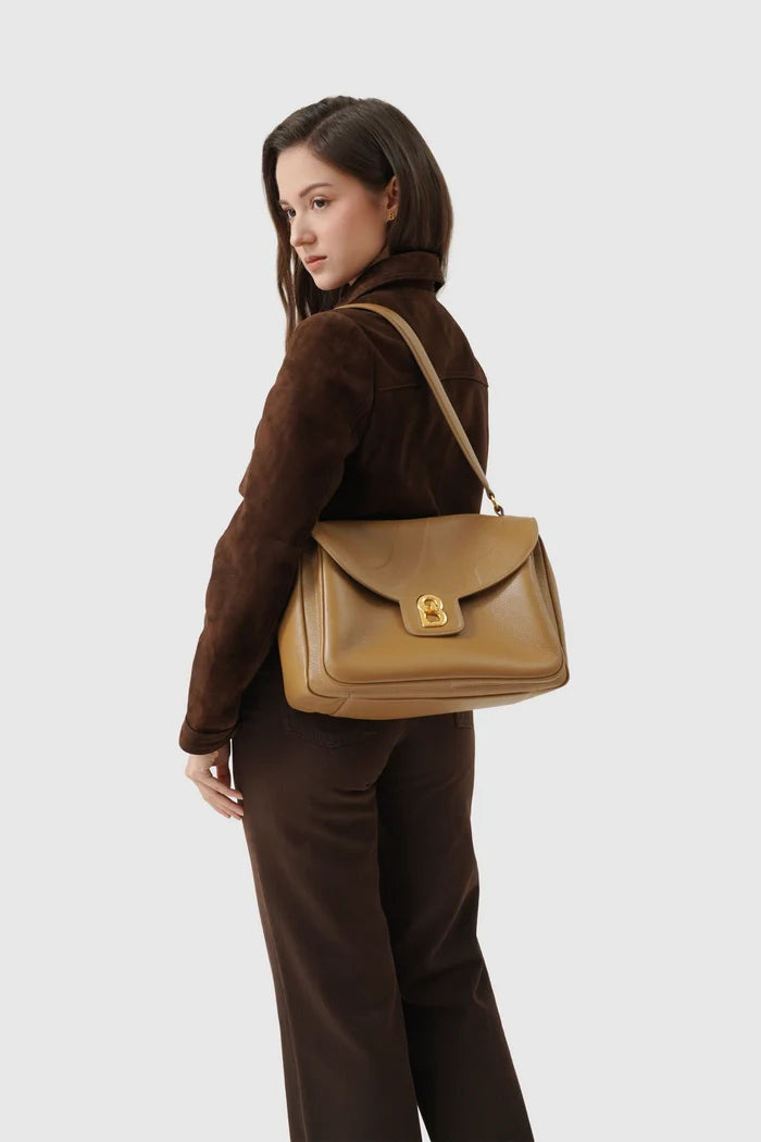 savina bag pebble leather in amber haze by buttonscarves carried on shoulder