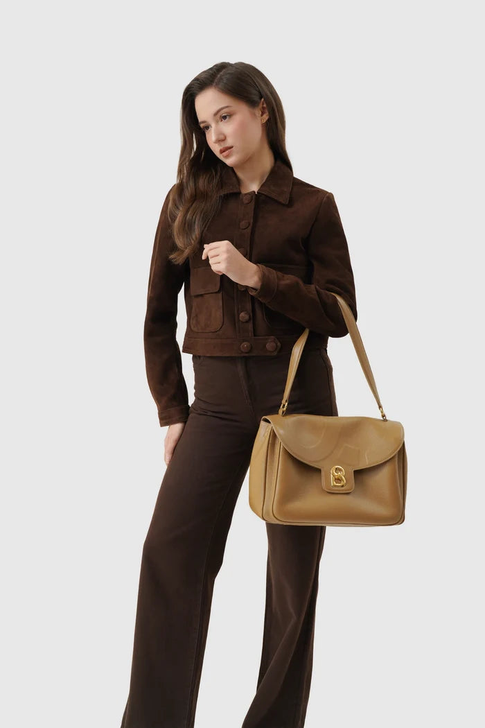 savina bag pebble leather in amber haze by buttonscarves carried on wrist