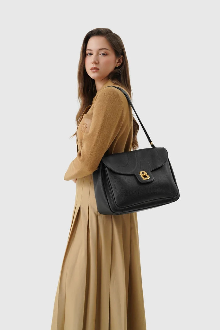 savina bag pebble leather in black by buttonscarves carried on shoulder