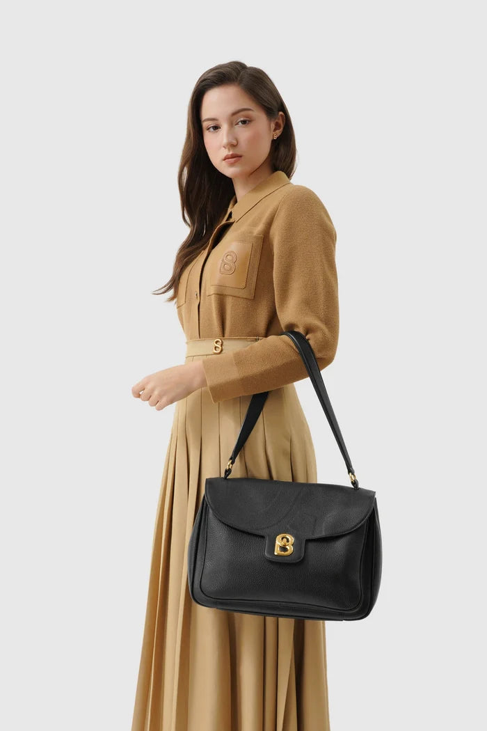 savina bag pebble leather in black by buttonscarves carried on wrist