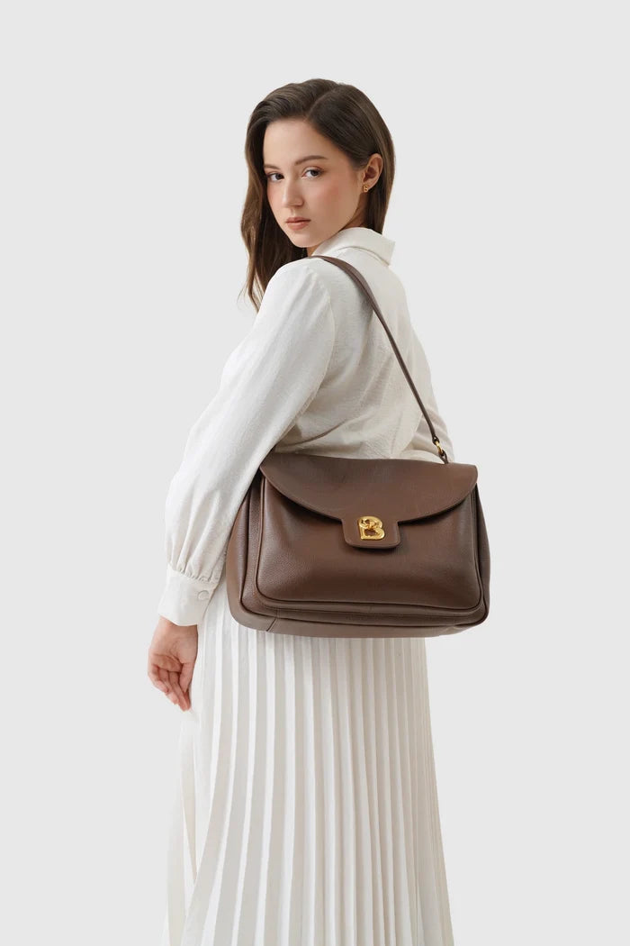 savina bag pebble leather in brown by buttonscarves carried on shoulder
