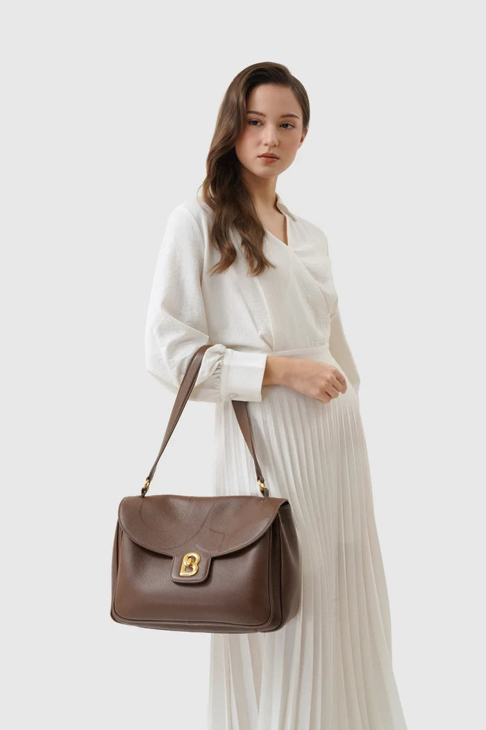 savina bag pebble leather in brown by buttonscarves carried on shoulder