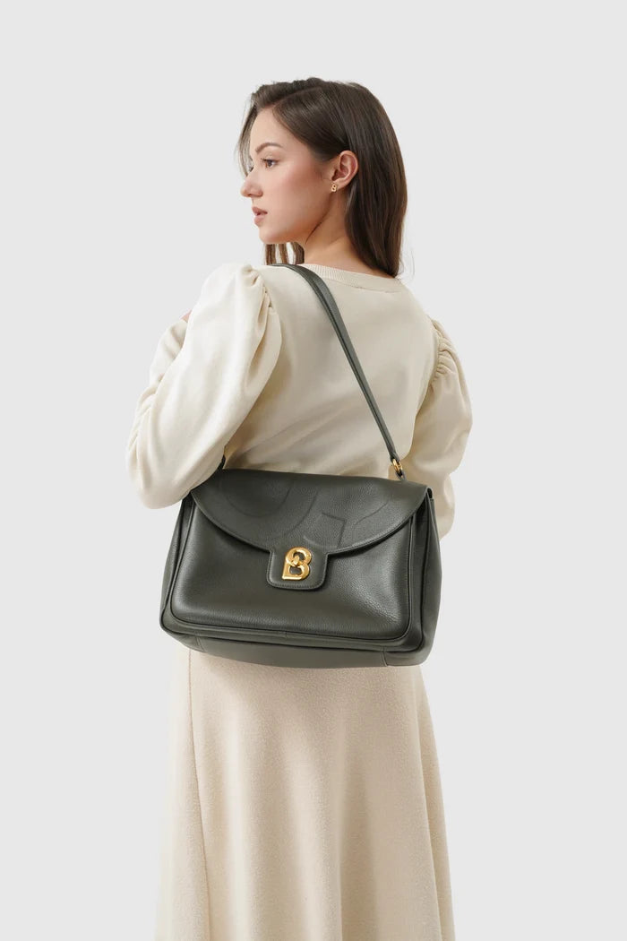 savina bag pebble leather in dark olive by buttonscarves carried on shoulder