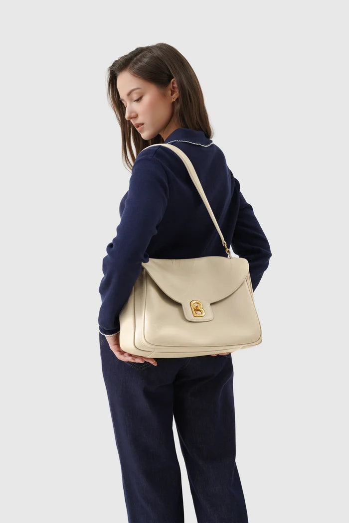 savina bag pebble leather in taupe by buttonscarves carried on shoulder