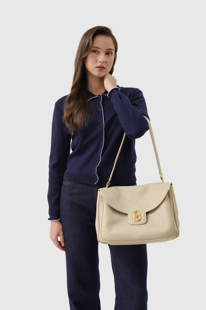 savina bag pebble leather in taupe by buttonscarves carried on wrist