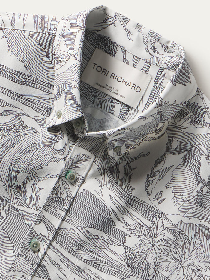Black and white tropical-print shirt, collar close-up with visible neck label