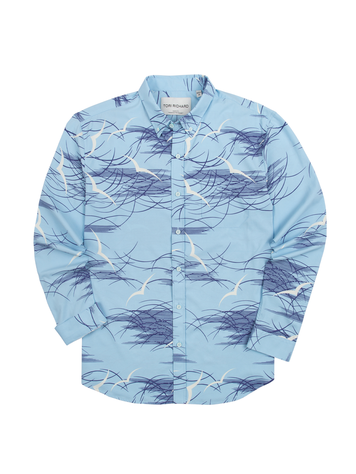 Light blue long-sleeve shirt with white seagull and navy wave print, flat lay front view.