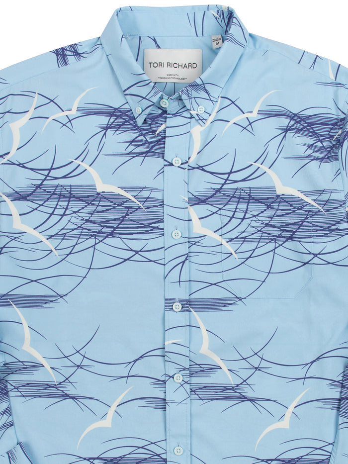 Light blue long-sleeve shirt with white seagull and navy wave print, front view.