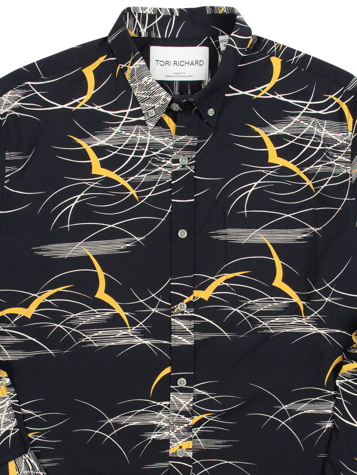 Black long-sleeve shirt with abstract wave print, and golden seagull print White wave-pattern long-sleeve shirt, shown from front and angled views.