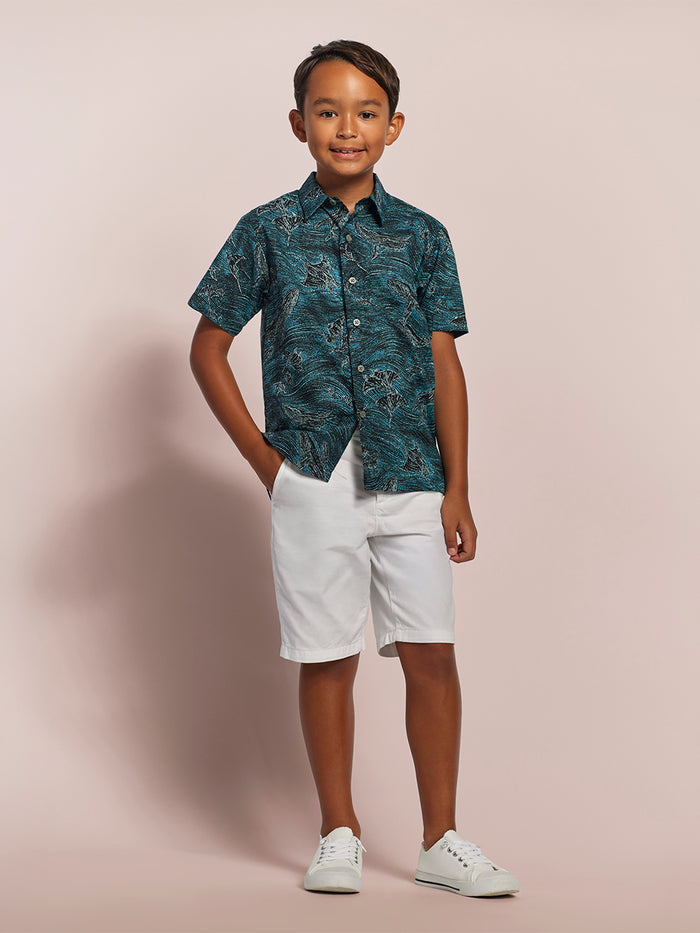 Blue and white ocean-print short-sleeve shirt with white shorts, front view shown in both images.