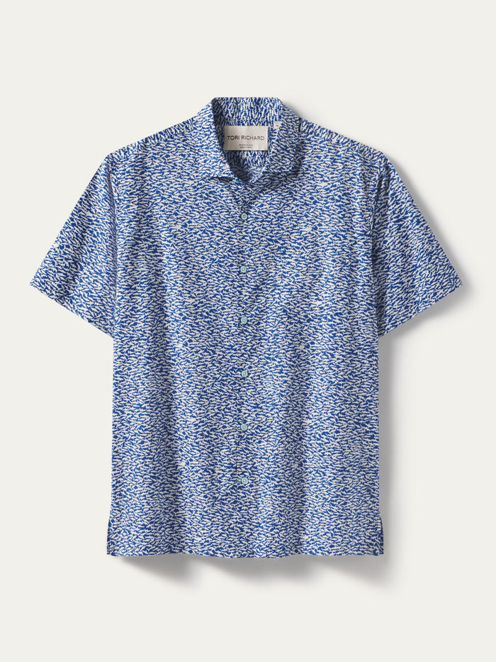 Blue and white wave-pattern Hawaiian-style short-sleeve cotton shirt, front view.