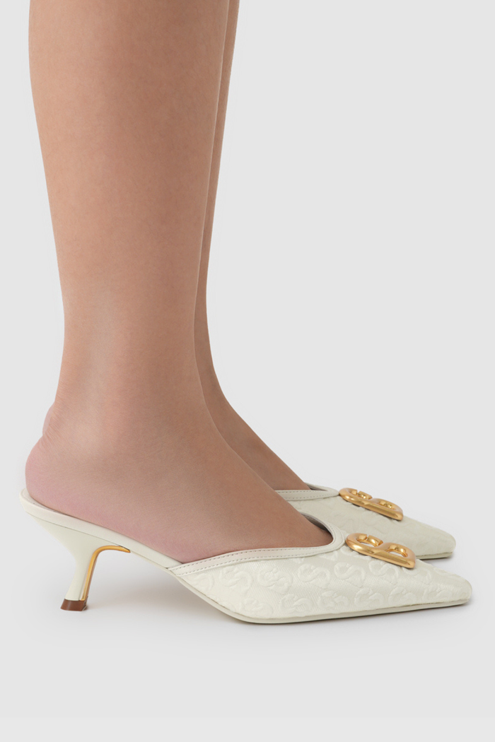 signature jacquard mules in broken white by buttonscarves worn side view