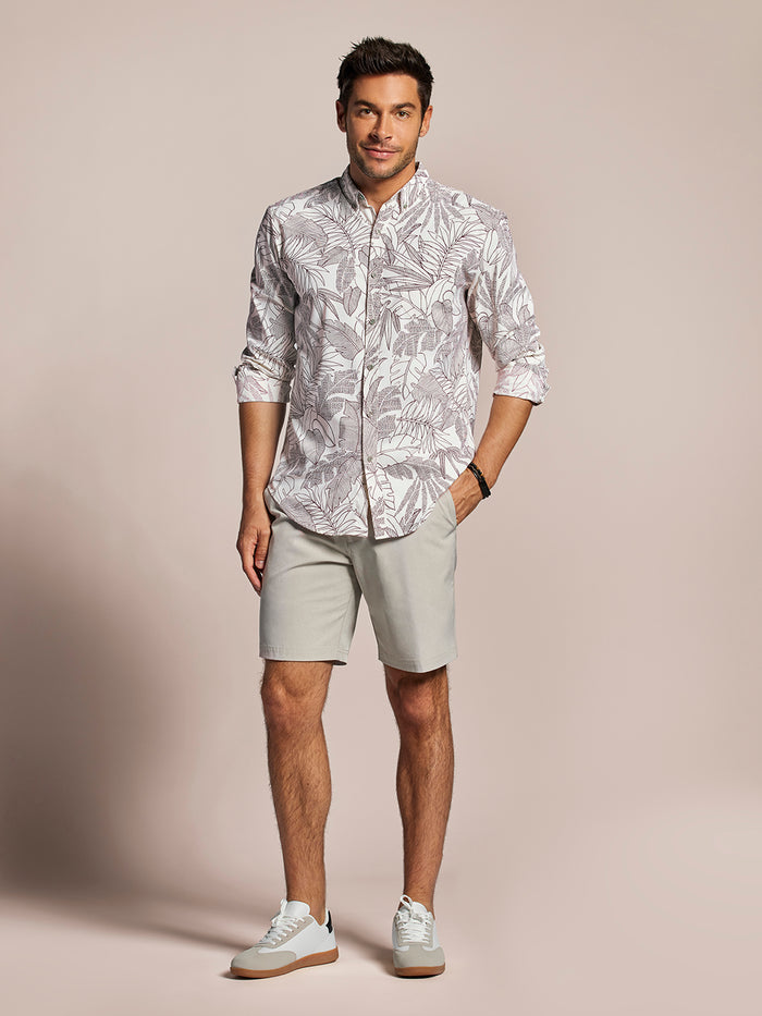 Off white long-sleeve shirt with beige shorts, front full-body view against beige background.