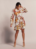 White calla lily print sleeveless dress with tan wedges, front view, light background .