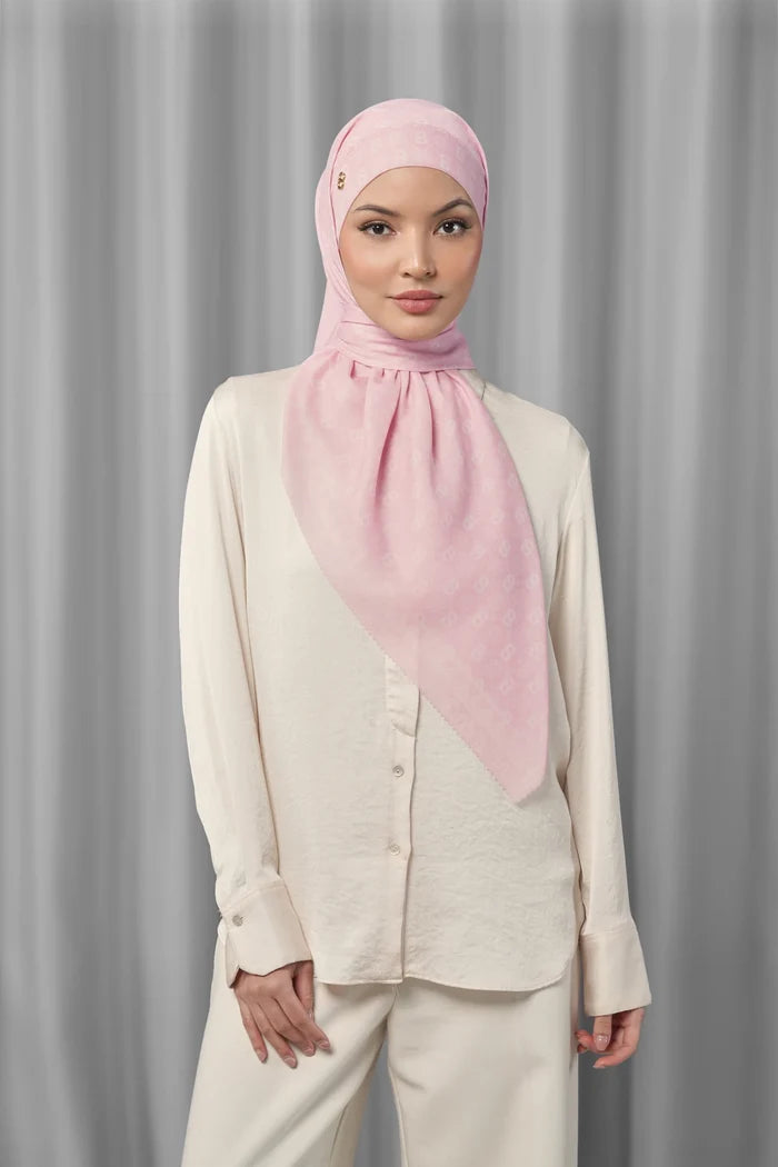 pink beach square scarf by buttonscarves styled in a modern hijab look