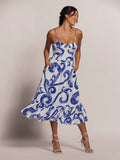 Blue swirl-print sleeveless dress with fitted corset bodice, hands in pockets, front view (Images 1 & 2).