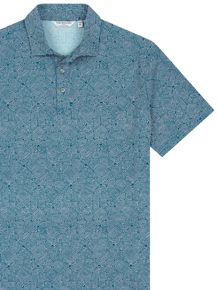 Blue geometric-pattern polo shirt, chest-up view laid flat.