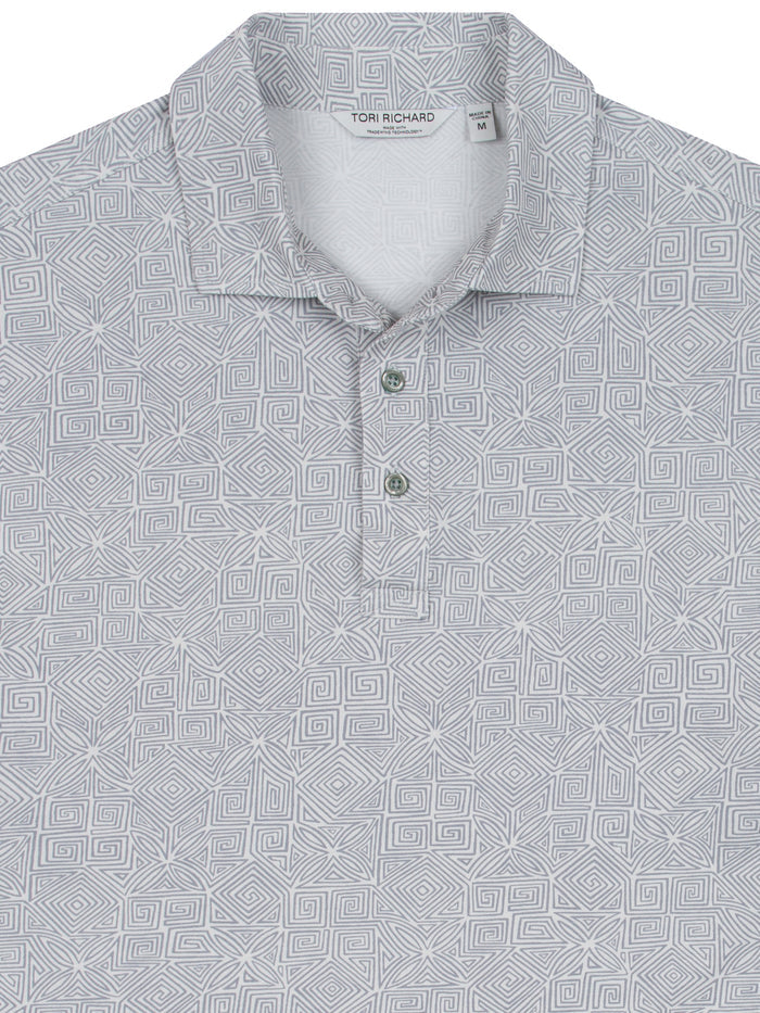 Gray geometric-patterned short-sleeve polo shirt with collar and three-button placket, front view.
