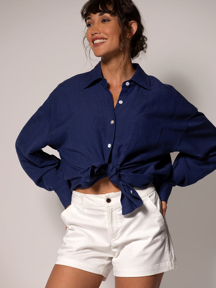 Navy linen Leslie long-sleeved top, tied at waist, front view.