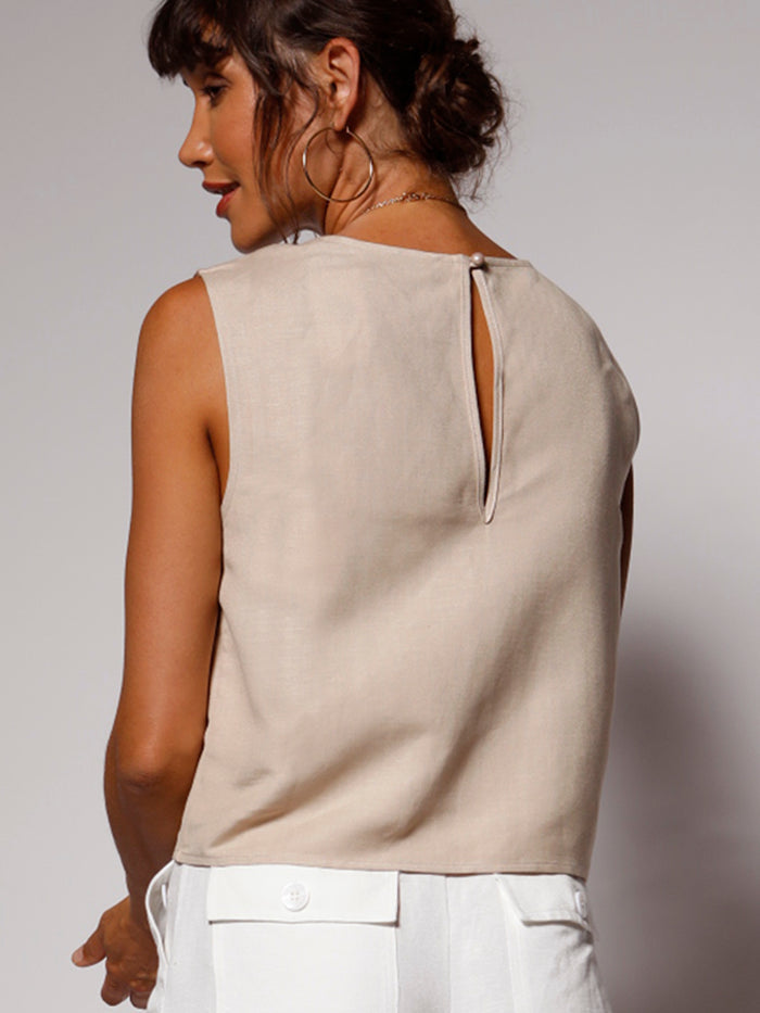 Light brown linen short-sleeve Lina top with keyhole back, paired with white pants; shown from back and front.