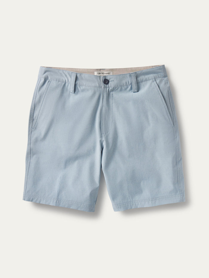 Light blue performance shorts, front view with belt loops, button closure, and front pockets.