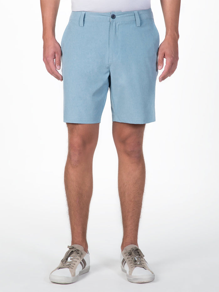 Light blue performance shorts, front view, paired with white shirt and sneakers.