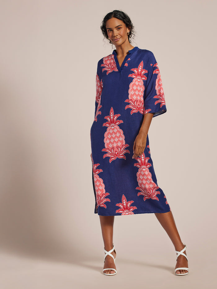 Blue caftan with pink pineapple print and kimono sleeves, front full-body view.