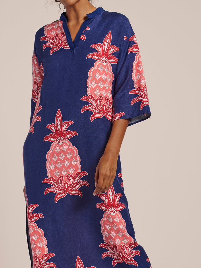 Blue caftan with pink/red pineapple print and kimono sleeves, front view.